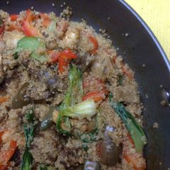 A picture of Quinoa with chicken and stir fried Asian veggies.
