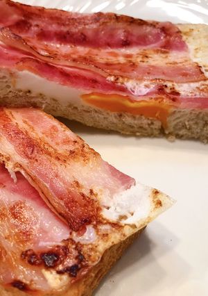 A picture of Egg-in-a-Hole Bacon Toast.
