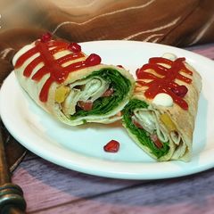 A picture of Khubz jarjeer salad rolls.