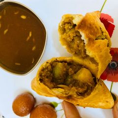 A picture of Samosa with instant amchur chutney.