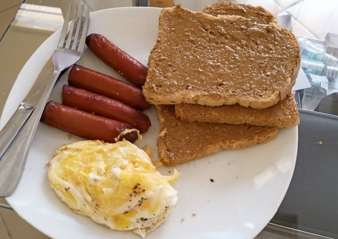 Eggs Sausages Brown Bread and Peanut Butter