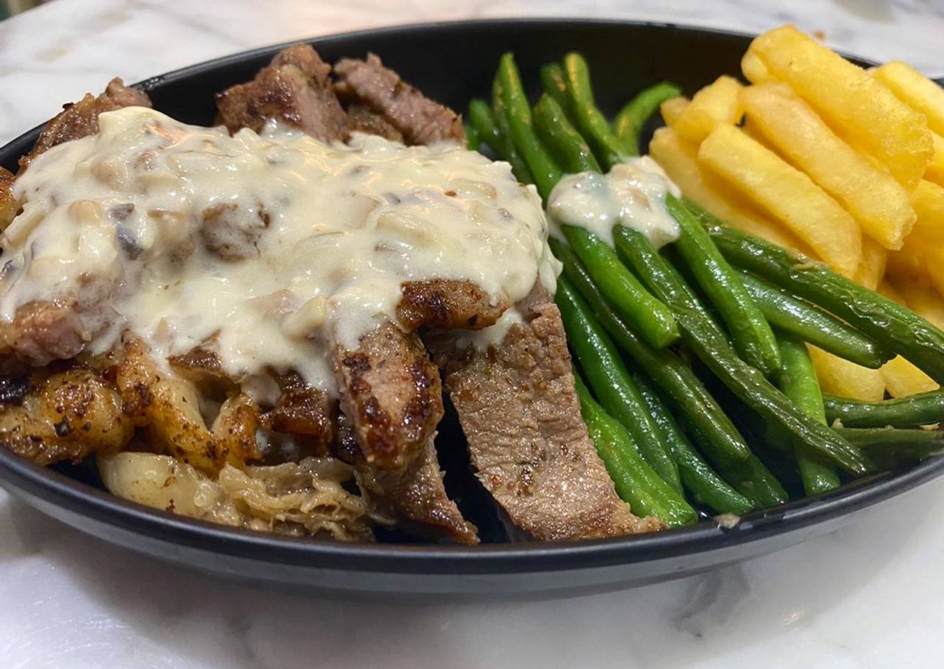 Ribeye steak with mushroom sauce