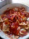Ravioli stuffed with spinach, ground beef, and Parmesan cheese