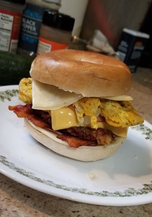 A picture of Four Meat, Four Cheese Bagel Breakfast Sandwich.