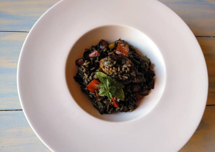 Arroz negro con conejo