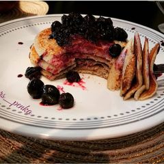 A picture of Pancakes with blueberry compote.