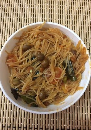 A picture of Vermicelli Upma with brown ChanaSatvik.