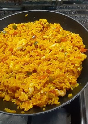 A picture of Chicken strips and rice.