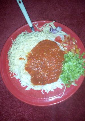 A picture of Rice stew and salad with super gatte.