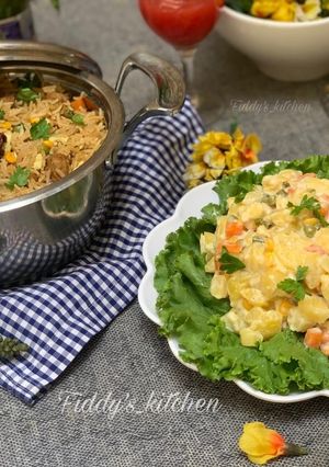 A picture of Chinese fried rice with Russian salad.