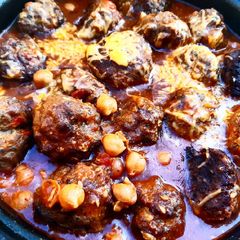 A picture of Meatballs and chickpea pot.