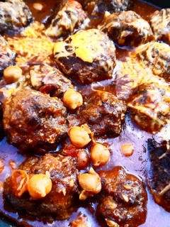 A picture of Meatballs and chickpea pot.