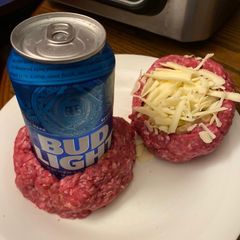 A picture of Air Fryer beer bottle stuffed bacon burgers.