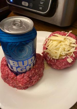 A picture of Air Fryer beer bottle stuffed bacon burgers.