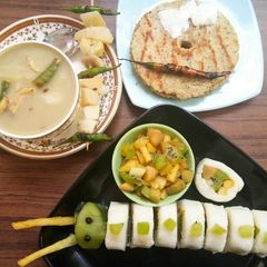 A picture of 5-Root vegetable soup, Jack fruit seed Thalipeeth, Frushi with salad.