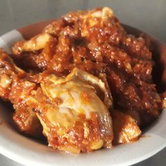 A picture of Chicken with tomato sauce.