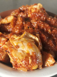 A picture of Chicken with tomato sauce.