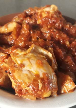 A picture of Chicken with tomato sauce.
