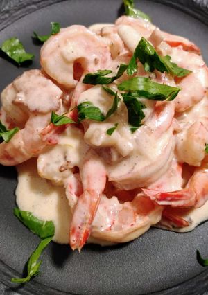 A picture of Prawns in bacon and cognac cream.
