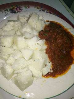A picture of Boiled Yam with Grilled Chicken Tomatoes Sauce.