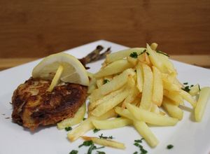Una foto de Fish and chips 🐟 (pescado estilo británico)
