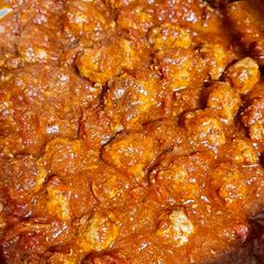 A picture of Meatballs in tomato sauce.