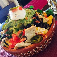 A picture of Fully loaded nachos.