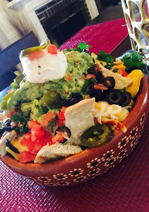 A picture of Fully loaded nachos.