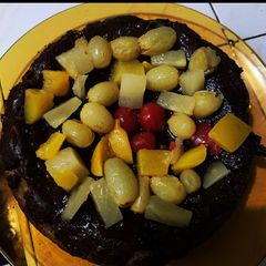 A picture of Banana Chocolate Cake w/ Fruit Toppings.