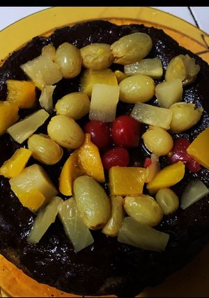 A picture of Banana Chocolate Cake w/ Fruit Toppings.