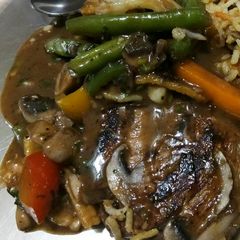 Grilled chicken with mushroom sauce and grilled veggies A picture of Grilled chicken with mushroom sauce and grilled veggies.