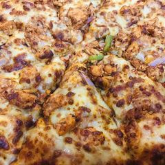 A picture of Chicken Tikka Pizza.