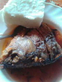 A picture of Nile Perch stew and Ugali.