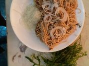 Una foto de spaghetti rúcula