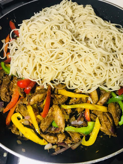 A picture of Chicken stir fry pasta.
