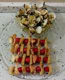 Brochetas de chocos y langostinos con almejas al ajillo