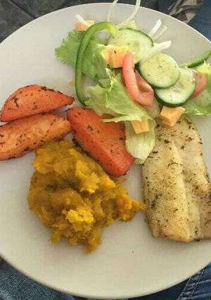 A picture of Grilled hake fillet with veggies.