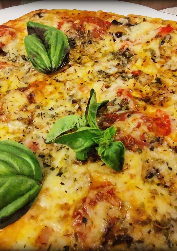 Una foto de Pizza Calabresa