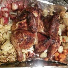 A picture of BBQ Roast chicken with veggies.