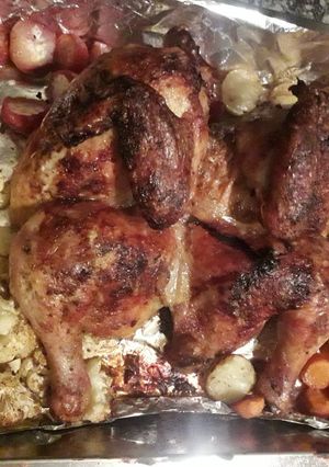 A picture of BBQ Roast chicken with veggies.