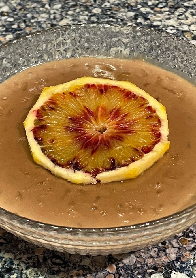 Una foto de Arroz con leche de chocolate y naranja sanguina