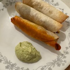 A picture of Fully loaded pork taquitos.