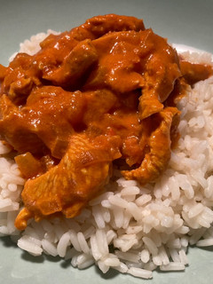 Una foto de Akoho sy voanio (Pollo en leche de coco)