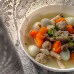 A picture of Quail Eggs Chicken Feet Carrots and Meatballs Soup.