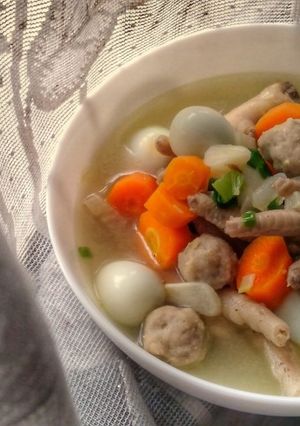A picture of Quail Eggs Chicken Feet Carrots and Meatballs Soup.