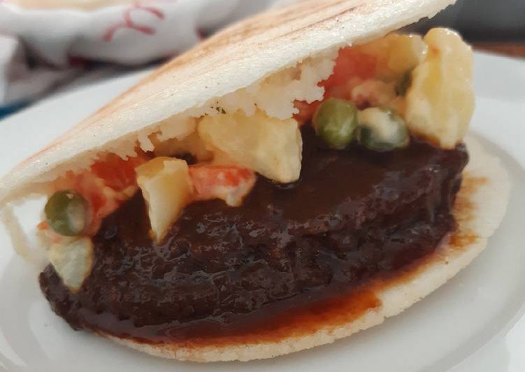 How to Prepare Ultimate Arepa 🇻🇪 rellena de asado negro y ensaladilla