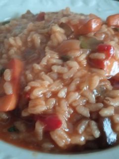 Una foto de Arroz meloso de verduras y calamar