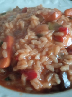 Una foto de Arroz meloso de verduras y calamar