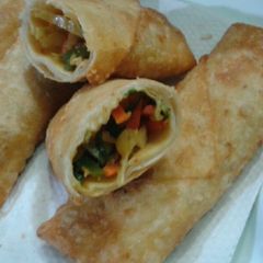 A picture of Chicken tikka spring rolls.