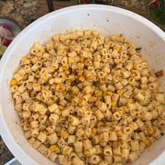 A picture of Macaroni salad with roasted corn.